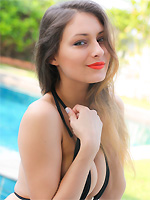 Yarina A slips out of her bathing suit by the pool